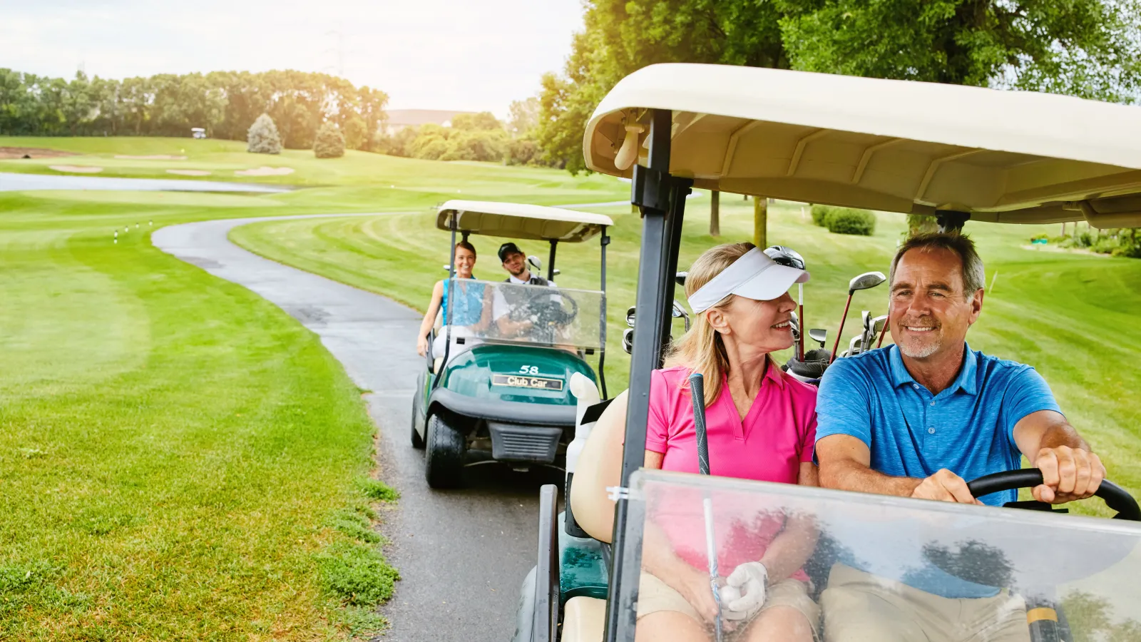 a group of people on a golf cart