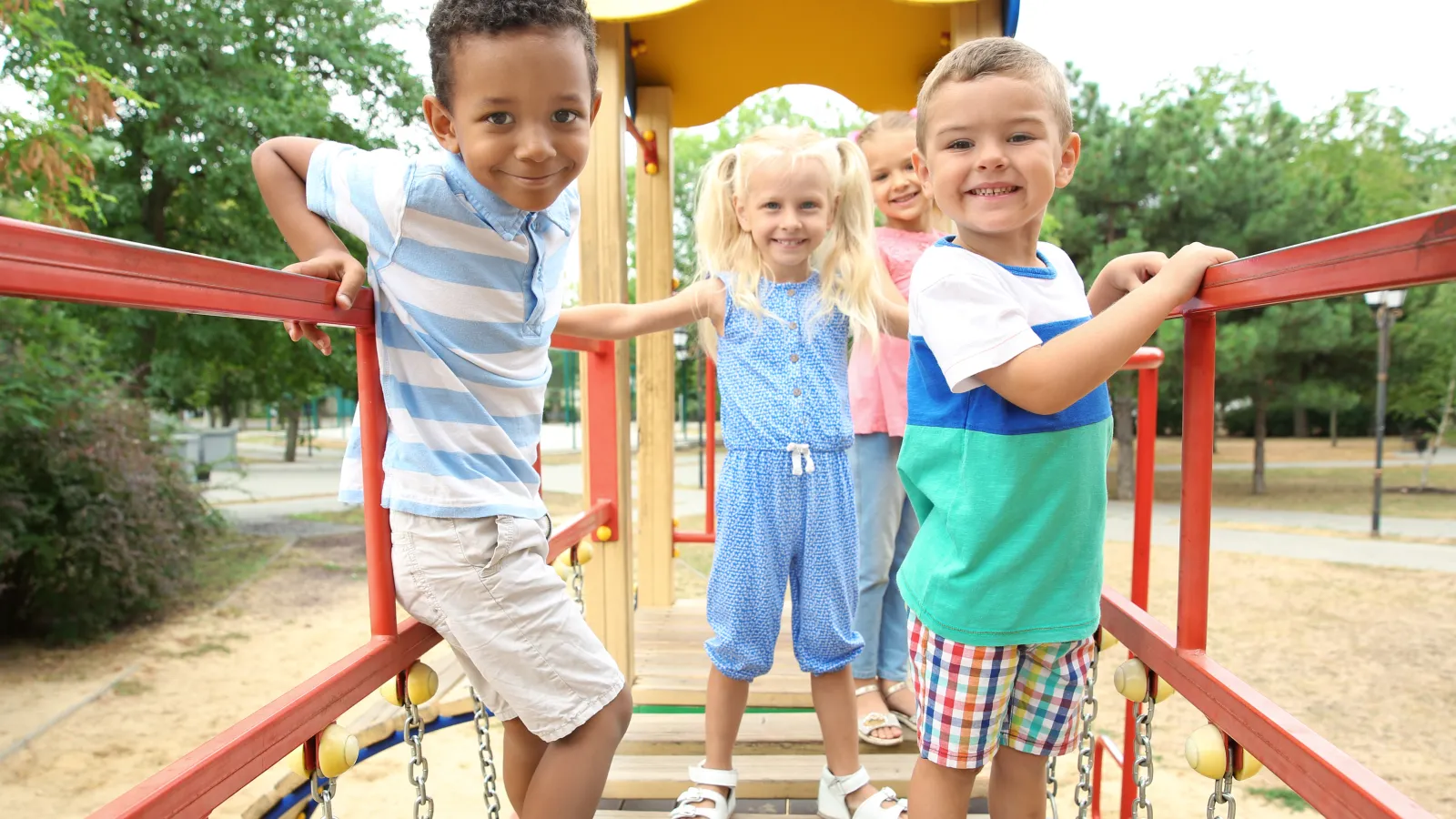 a group of children playing on a playground