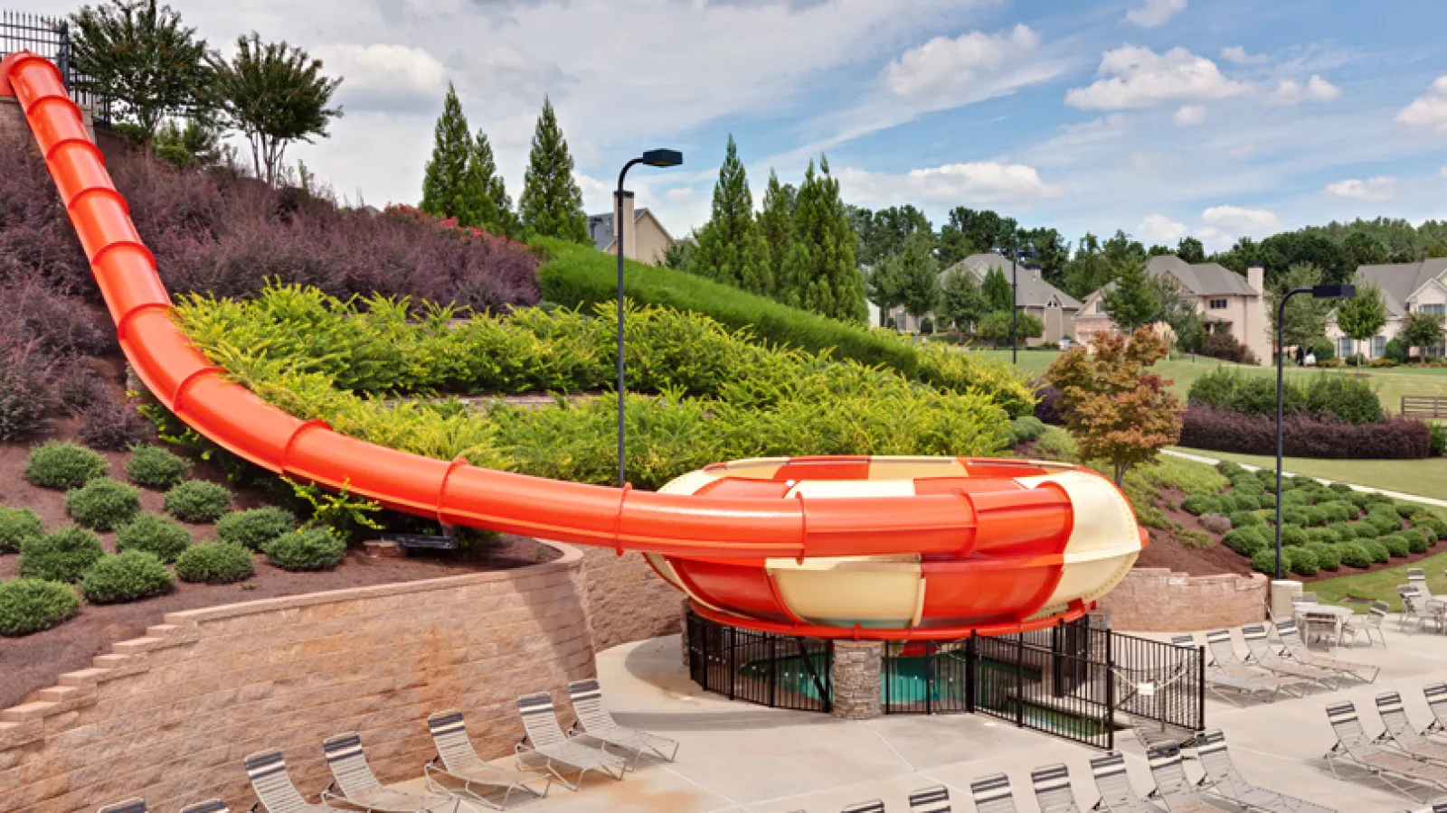 a red and white structure in a garden