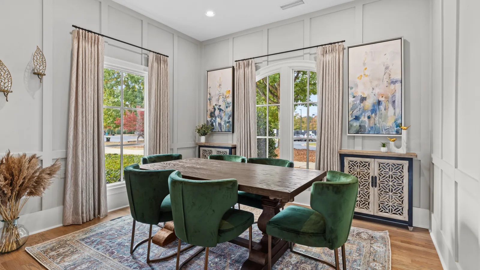 a dining room with a table and chairs