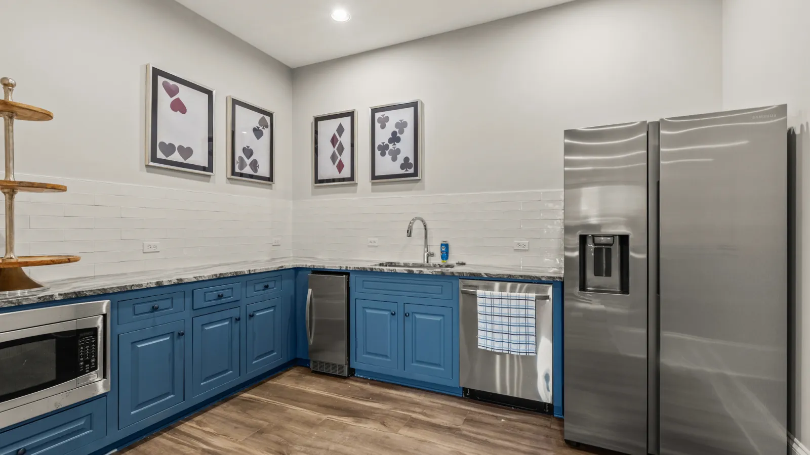 a kitchen with blue cabinets