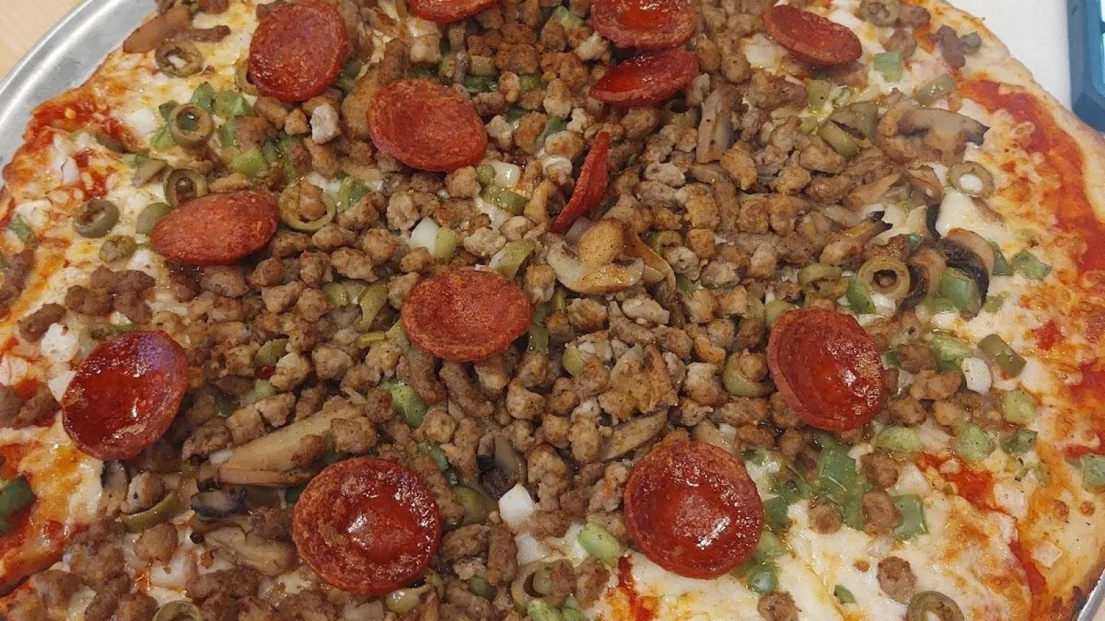 a pizza with tomatoes and cheese