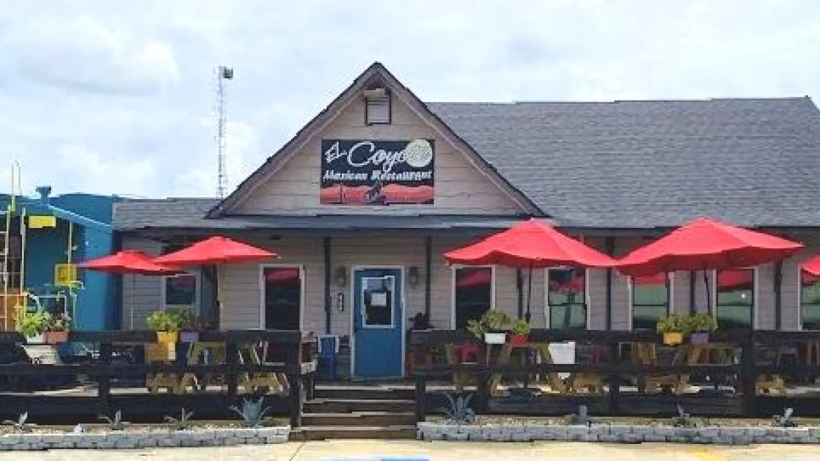a building with tables and chairs outside