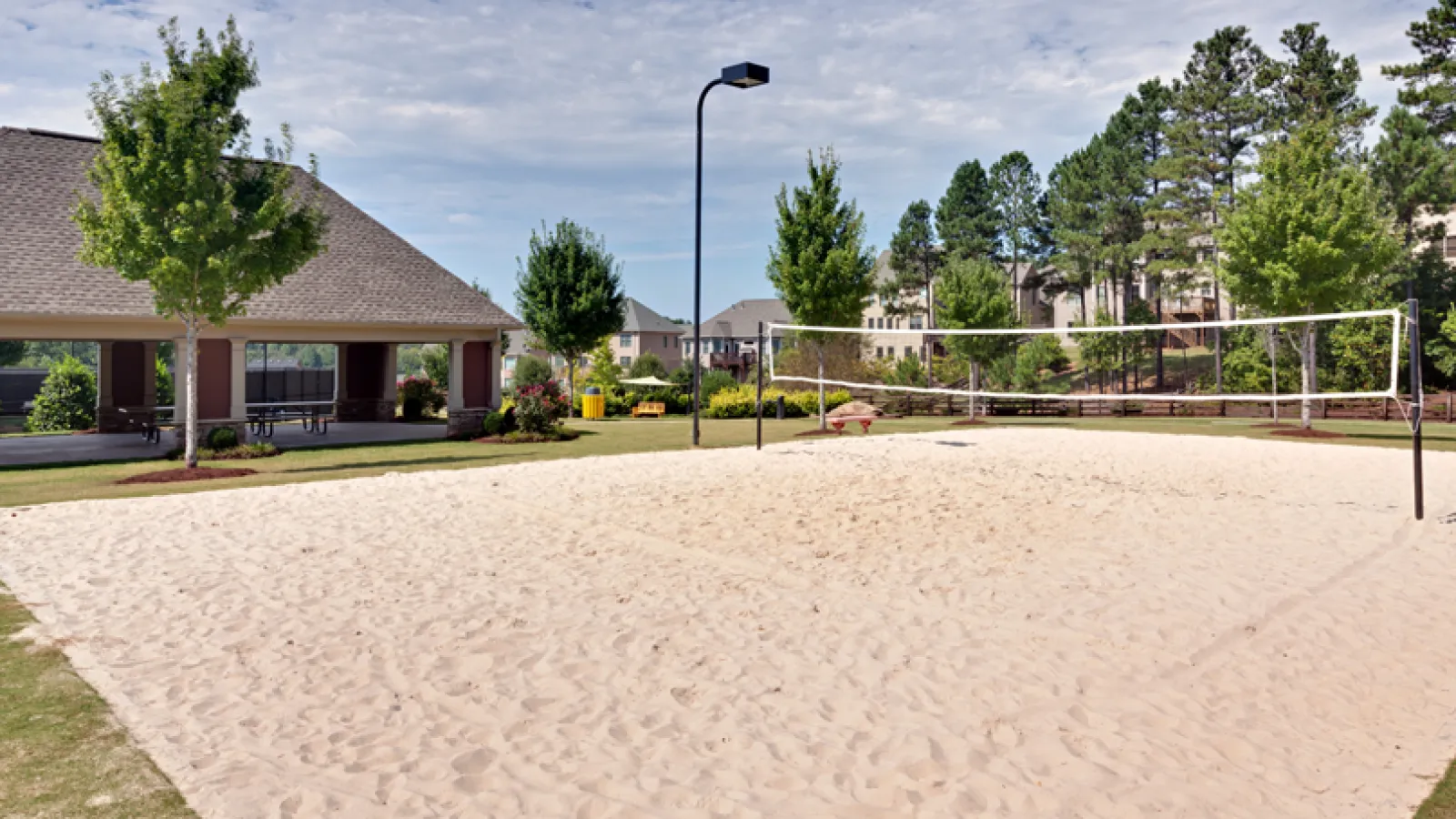 a dirt path leading to a building