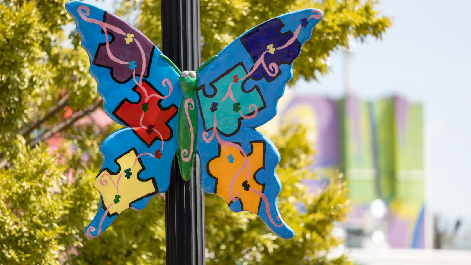 a couple of butterflies on a pole