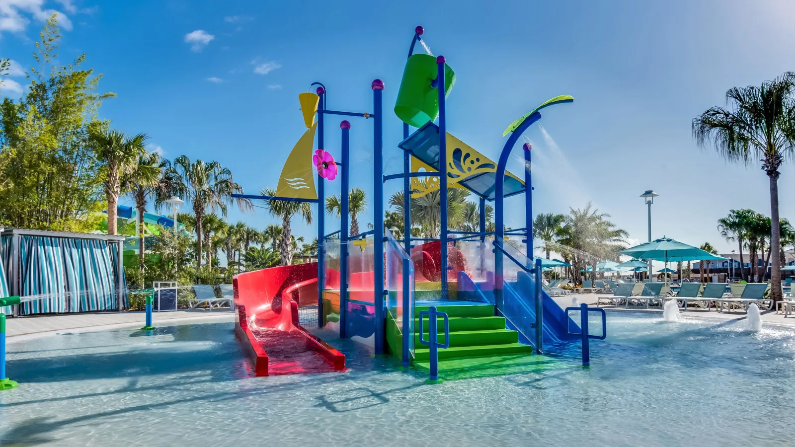 a playground with blue and yellow poles