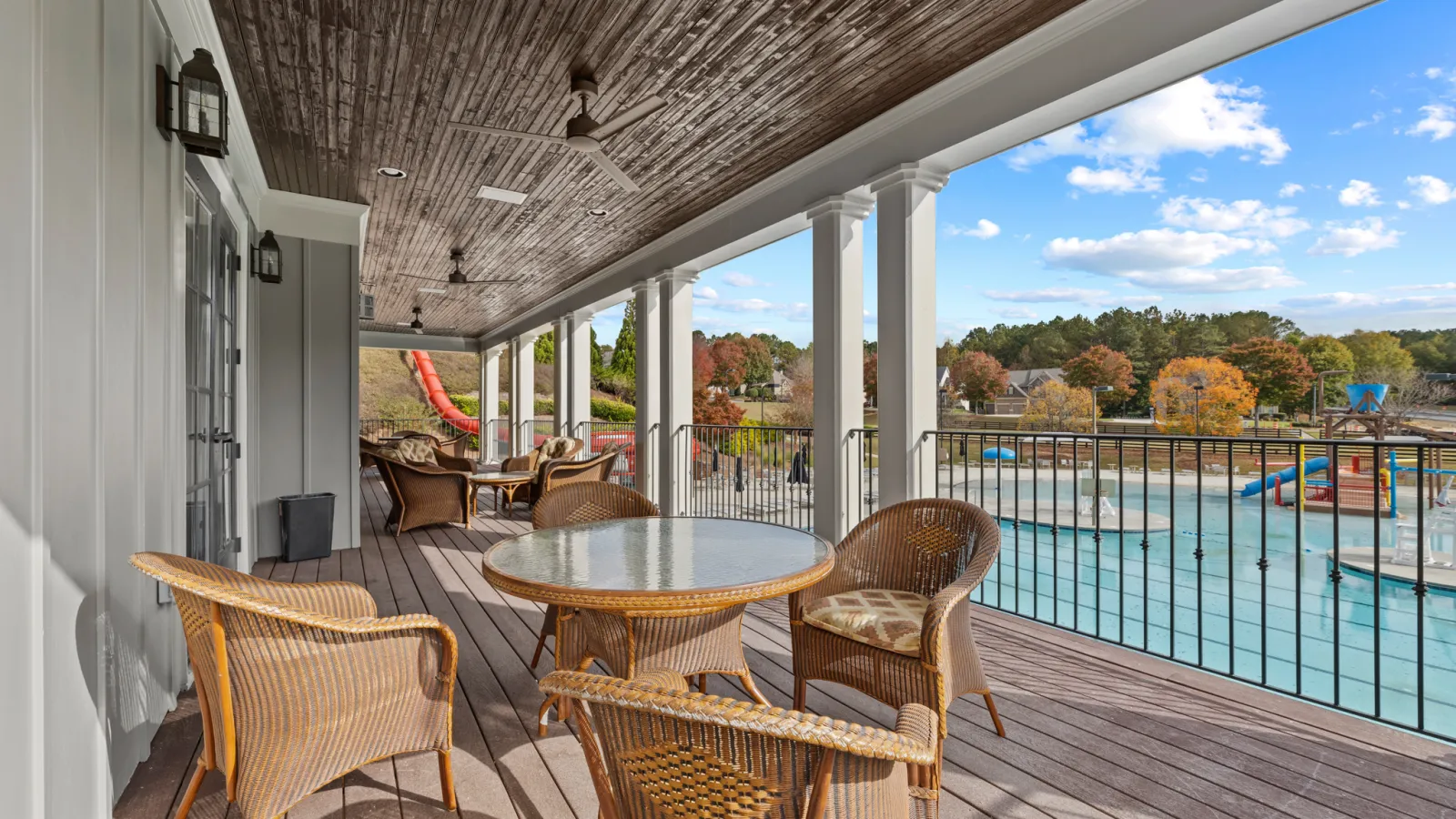 a deck with tables and chairs