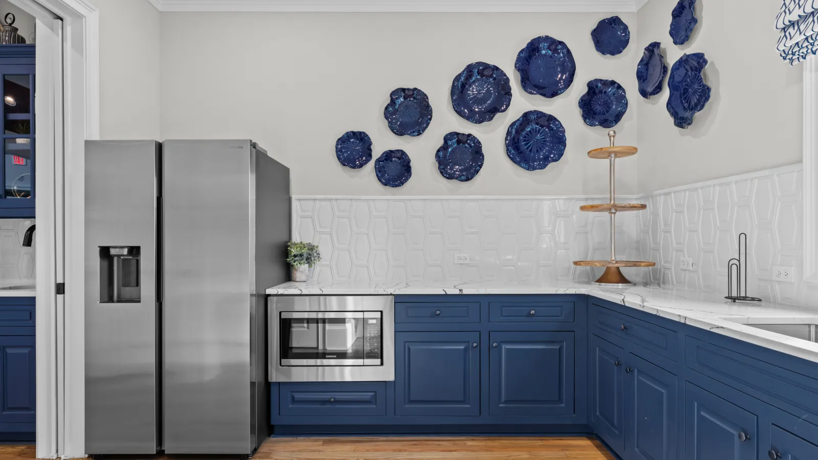 a kitchen with blue cabinets