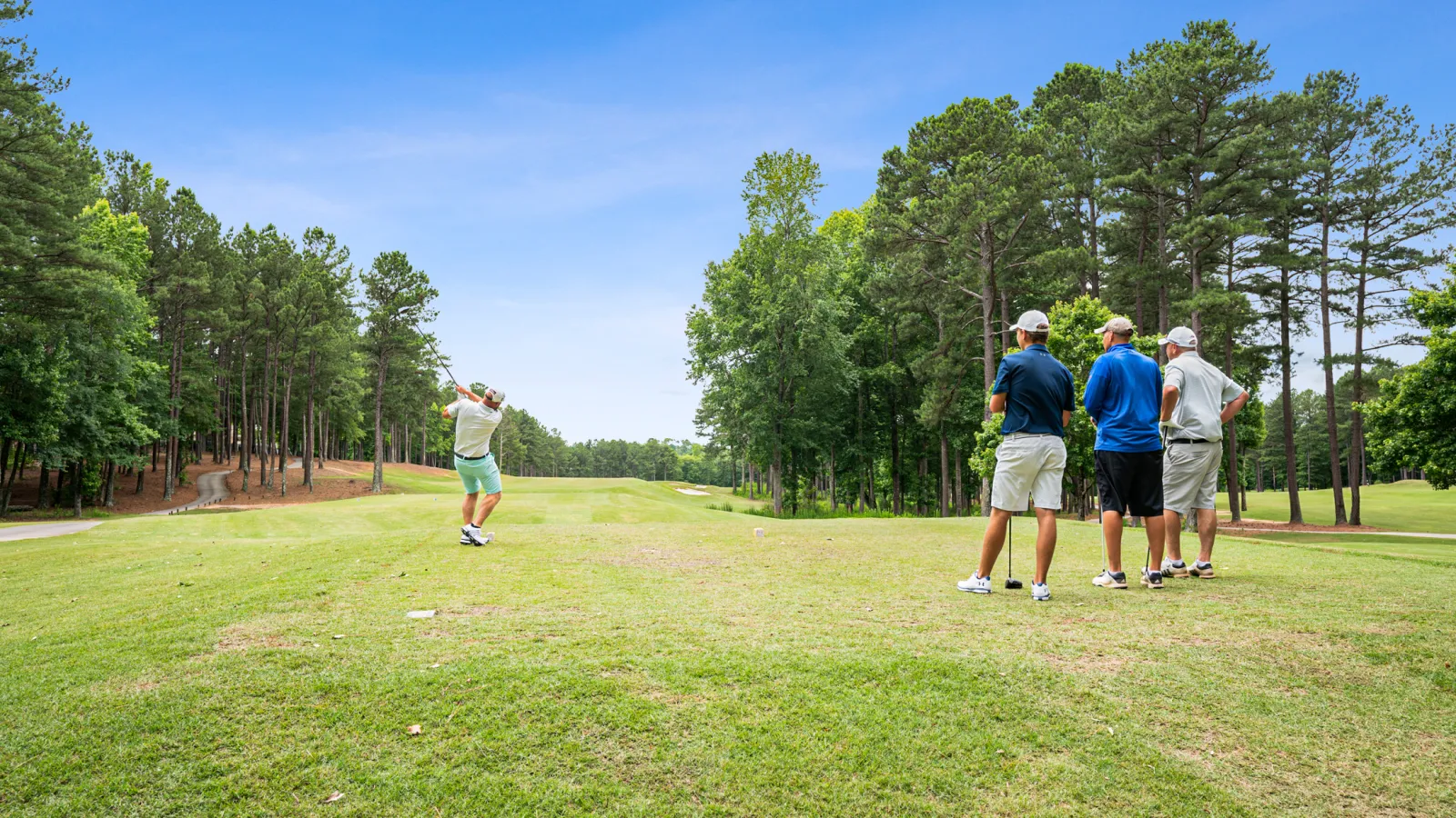 a group of people playing golf