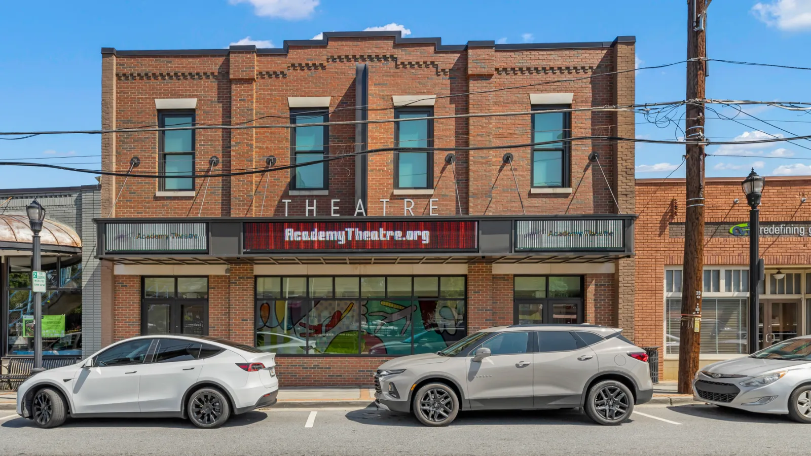 cars parked in front of a building