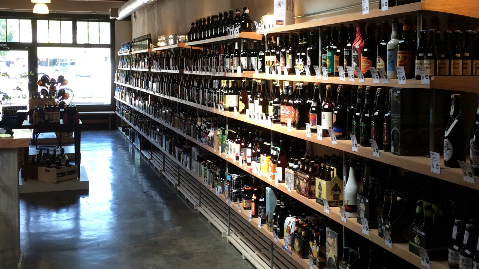 a large room with many bottles of wine on shelves