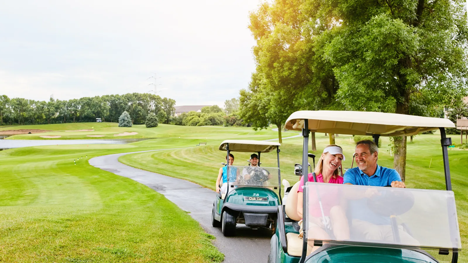 a group of people driving golf carts