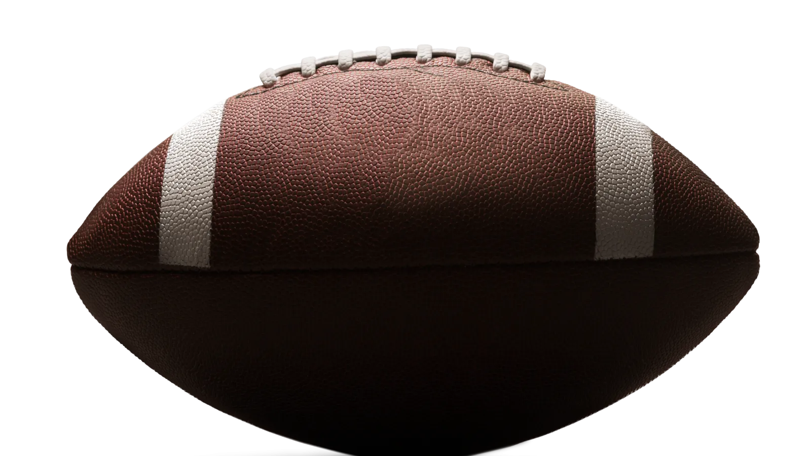 Close-up of a brown American football with white laces and stripes on a black background