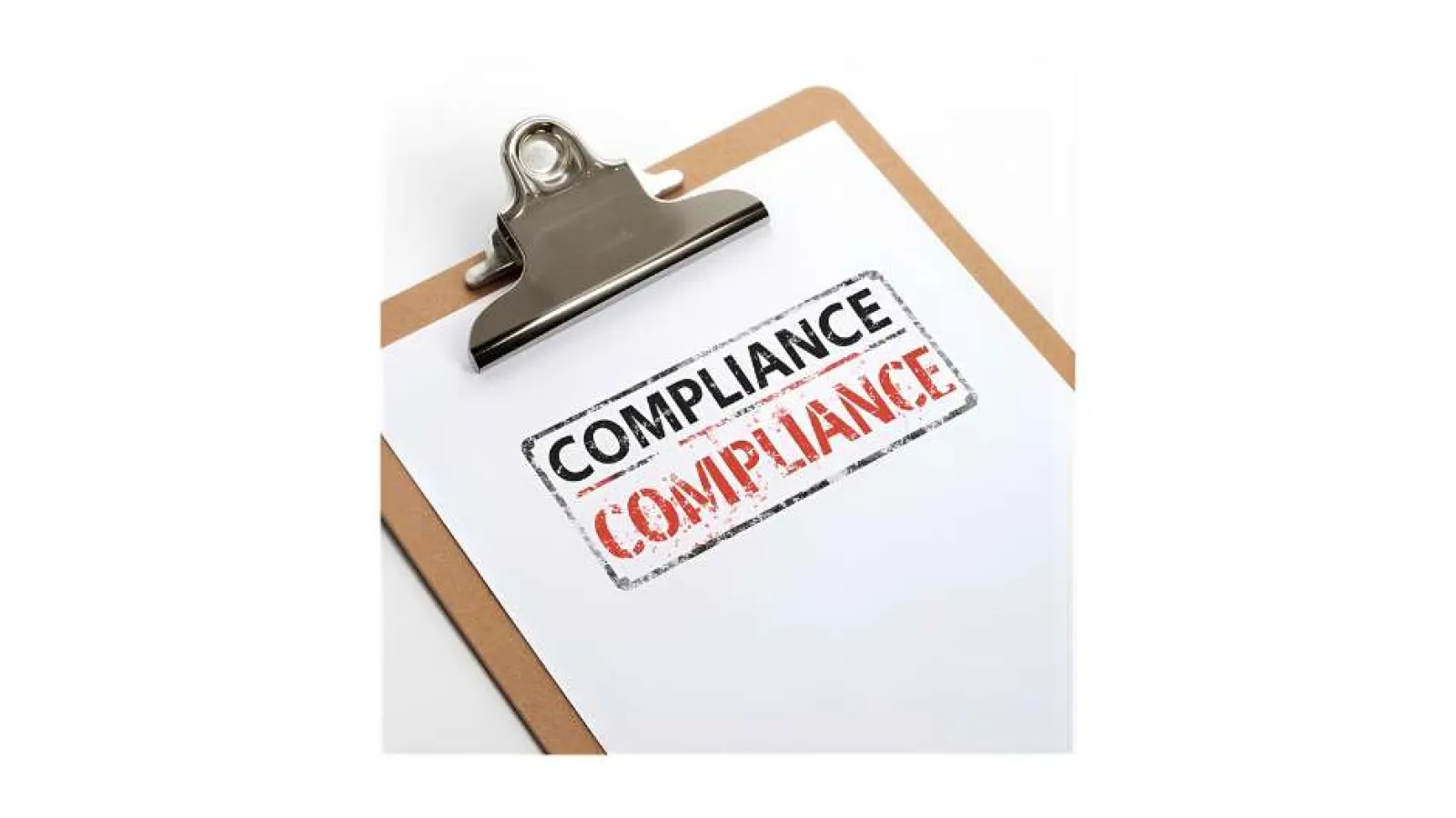 Clipboard with paper stamped twice with the word Compliance in black and red ink.