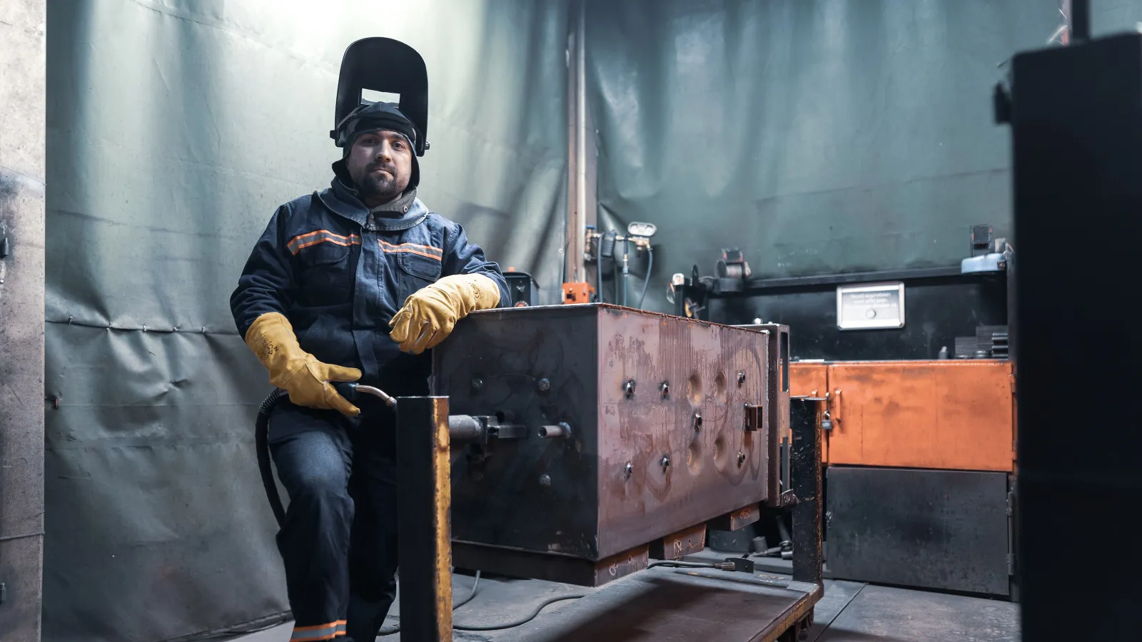 a man in a uniform sitting on a wooden box