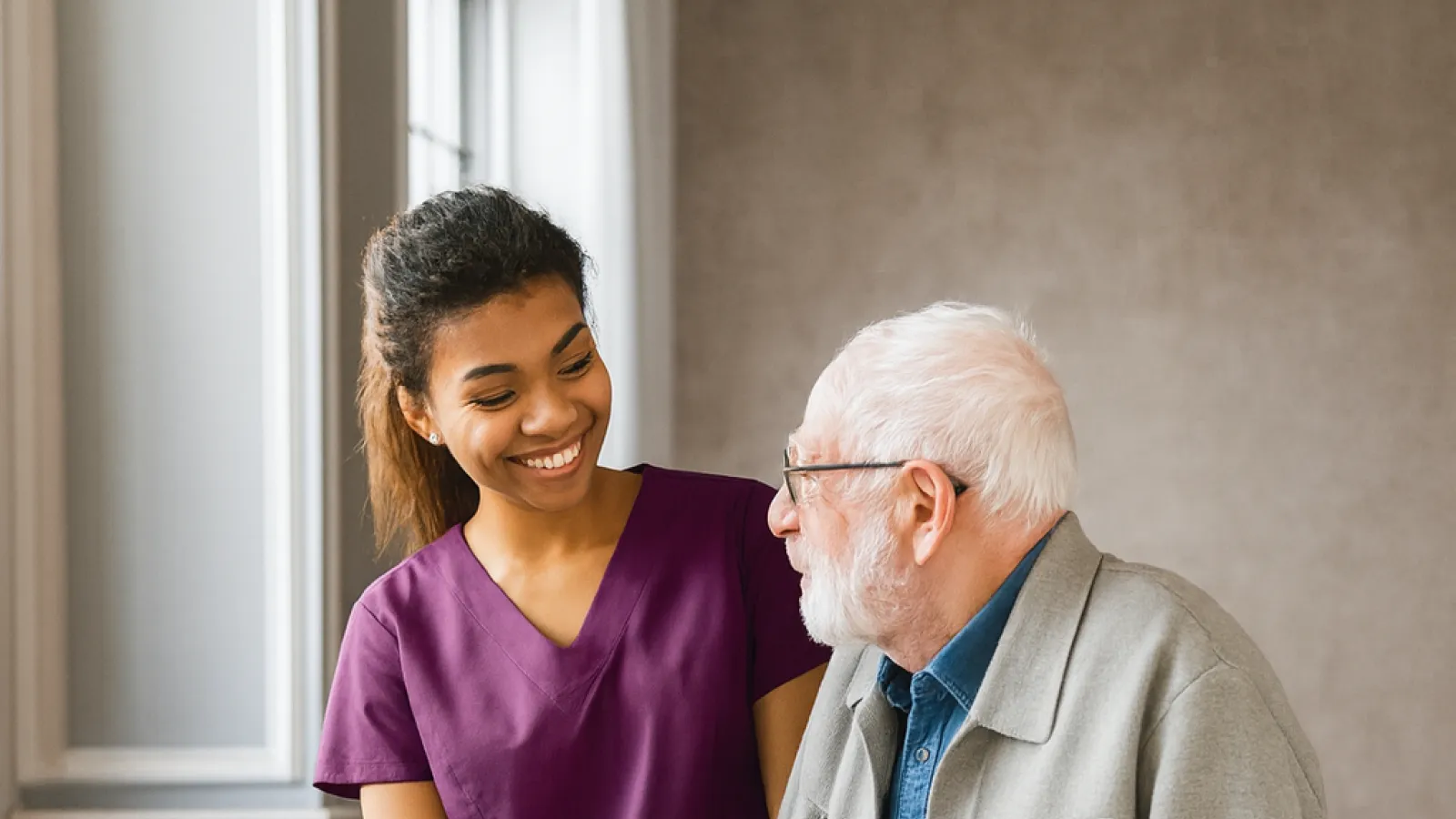 Smiling nurse assisting elderly man using walker in a cozy living room