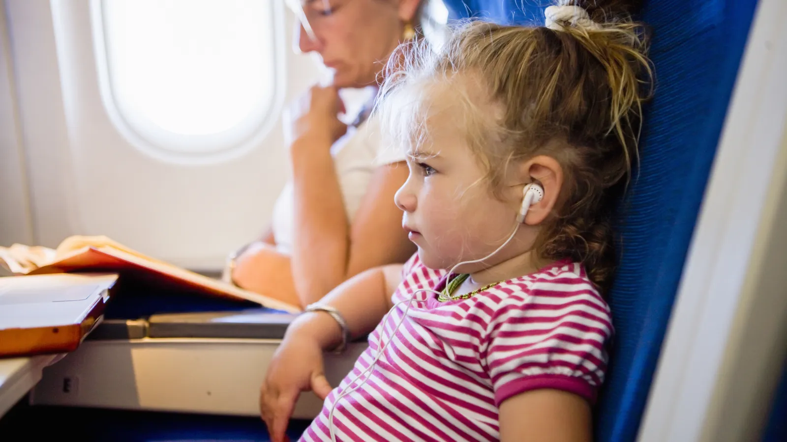 a person and a child on an airplane