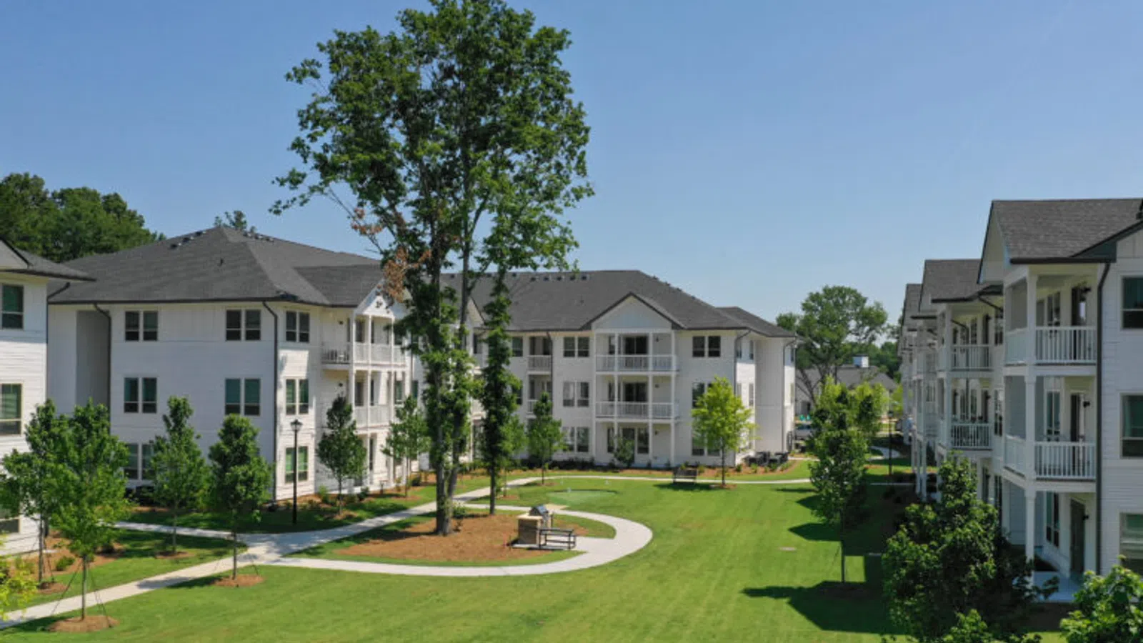 a large building with trees in front of it