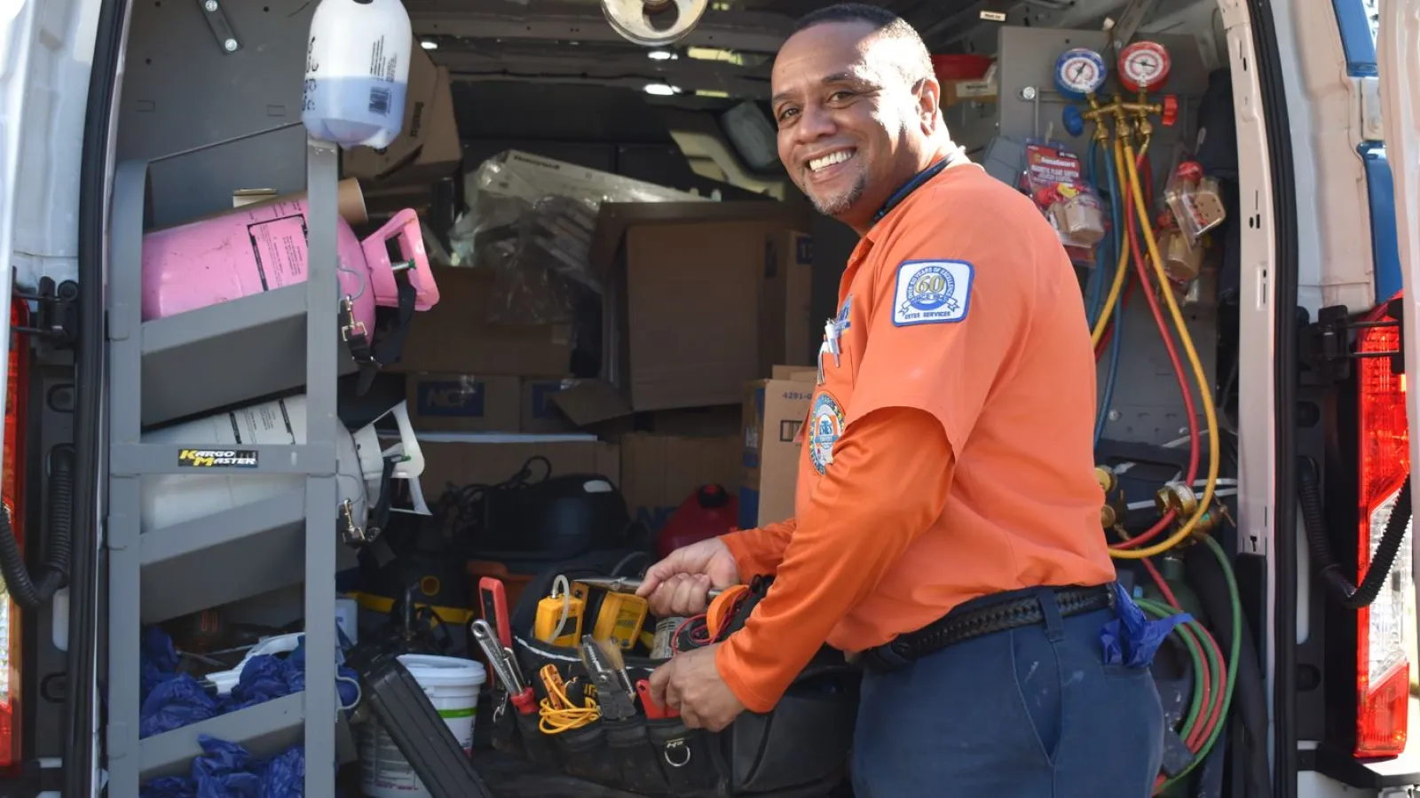 Estes Services Technician Fixing an AC