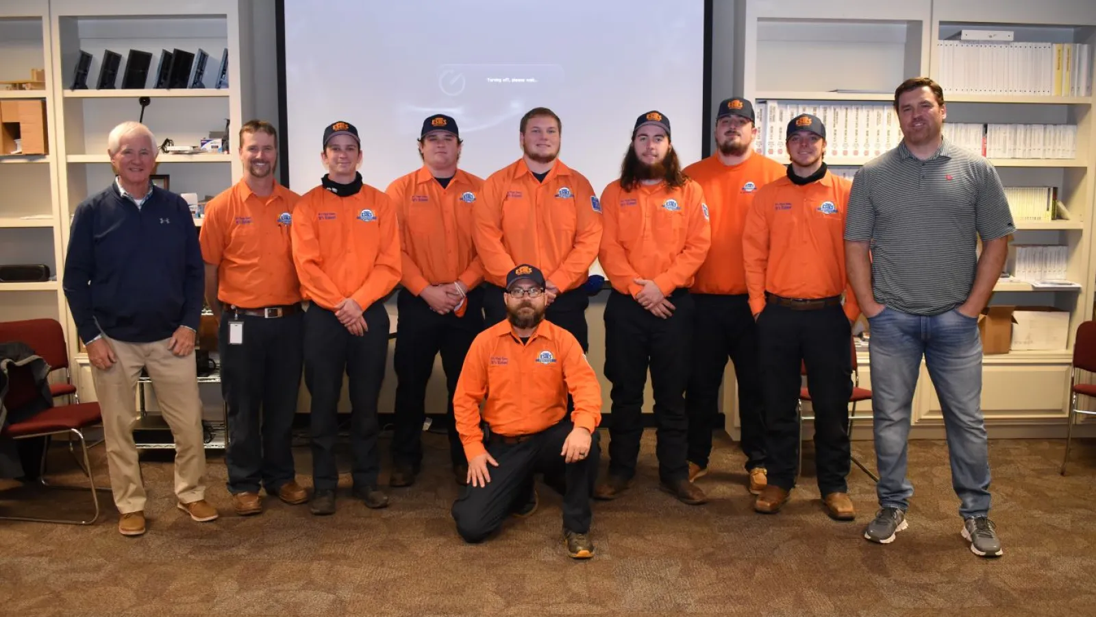 Estes team in front of store