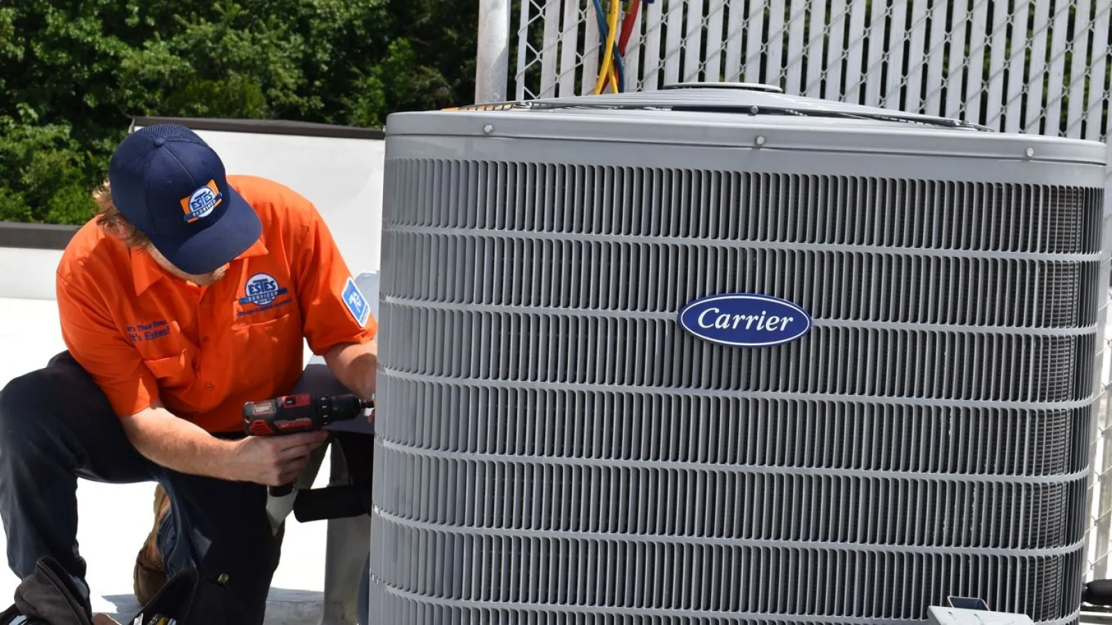 Estes Services HVAC Technician working on a Carrier Equipment