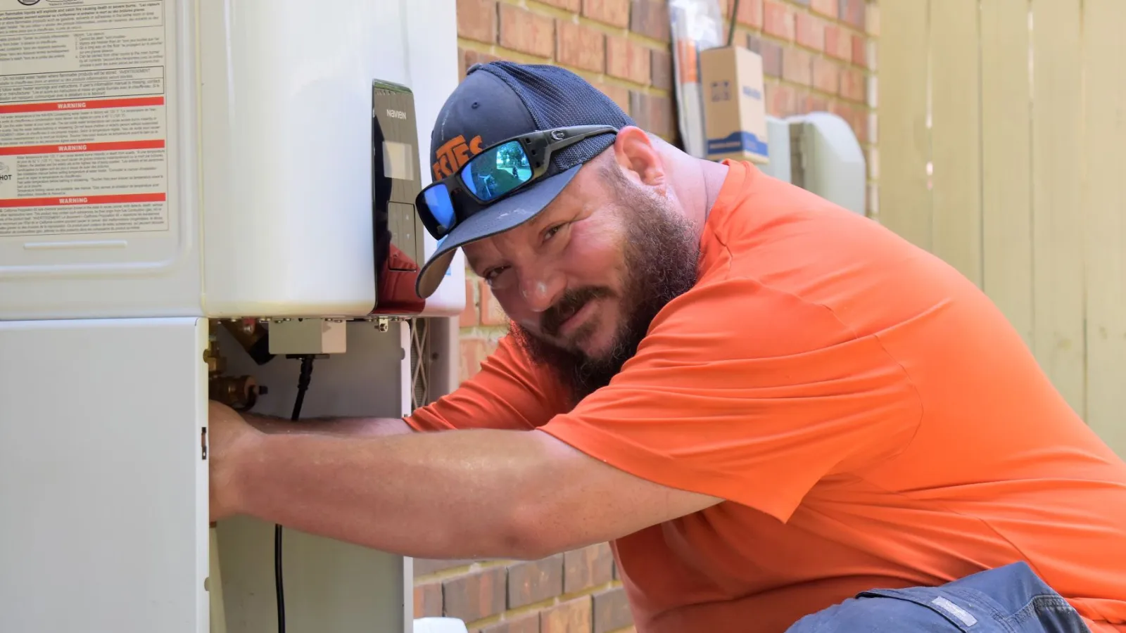 Estes Plumber installing a tankless water heater in Smyrna