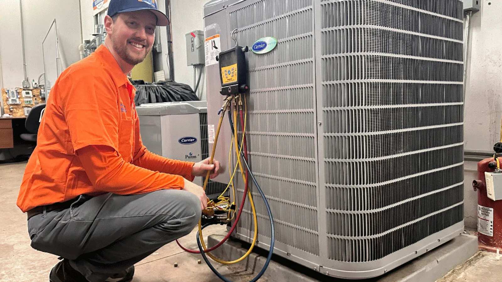 Estes Services Technician working on a Heat Pump