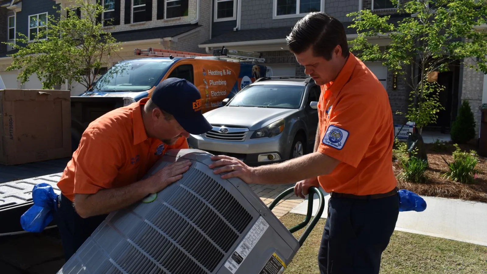 Estes Services Technicians Installing an AC