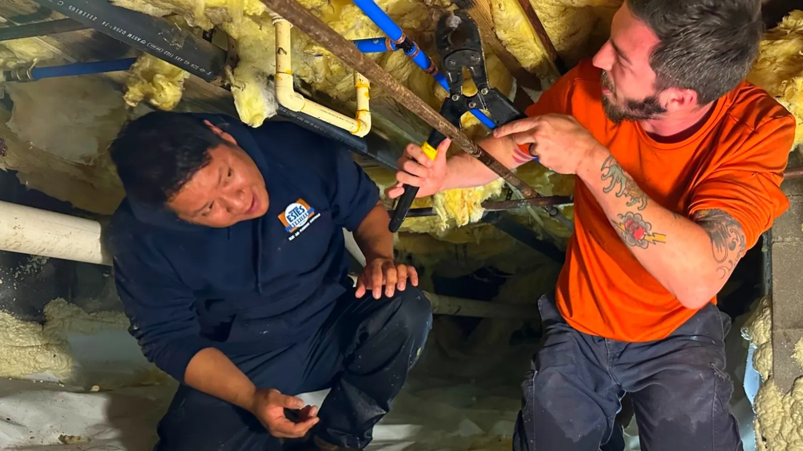 Estes Plumbers working in a crawl space repiping a house in Atlanta Metro