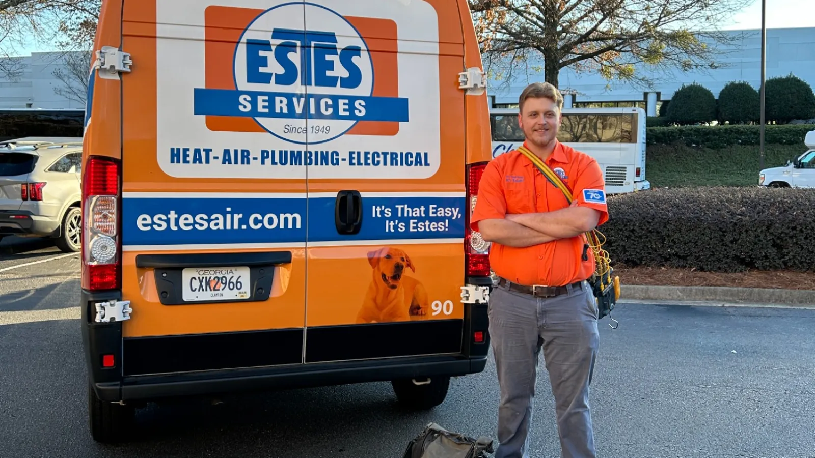 Estes Services HVAC Tech in front of amTruck