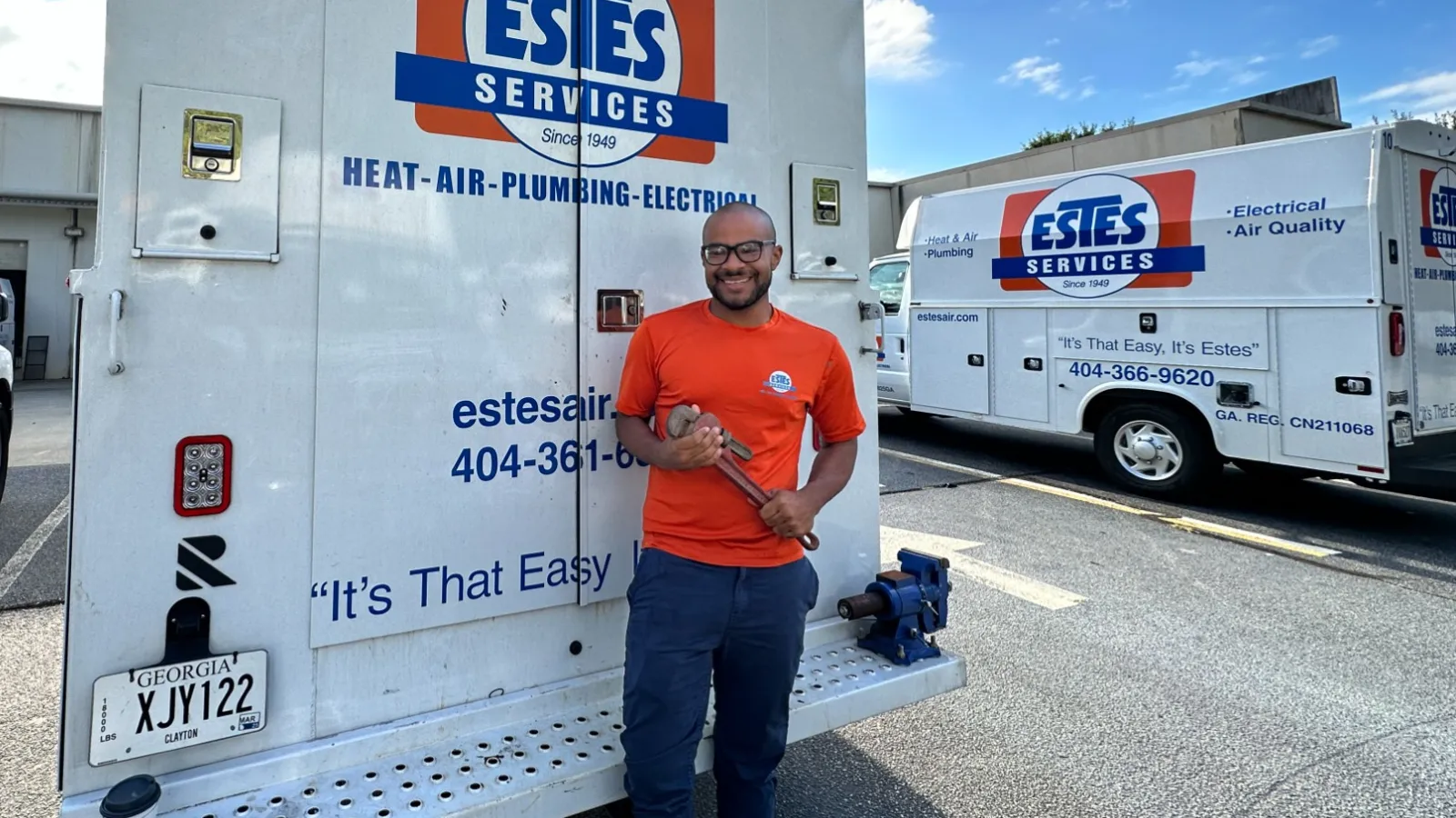 Estes Services Plumber in front of an Estes Plumbing Truck