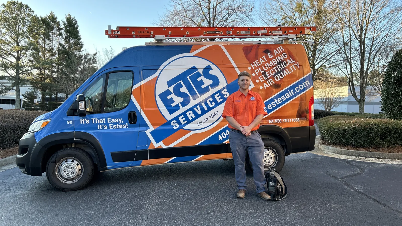Estes Services HVAC Repairman in front of a Truck