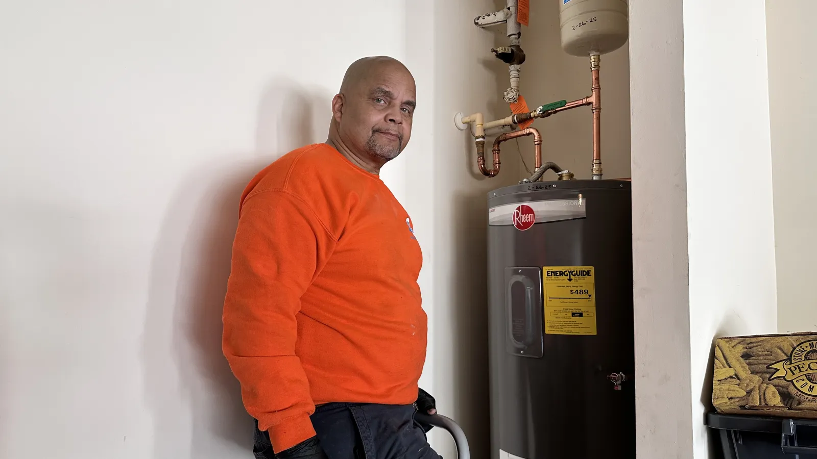 Estes Plumber installing a Rheem water heater in a home utility room.