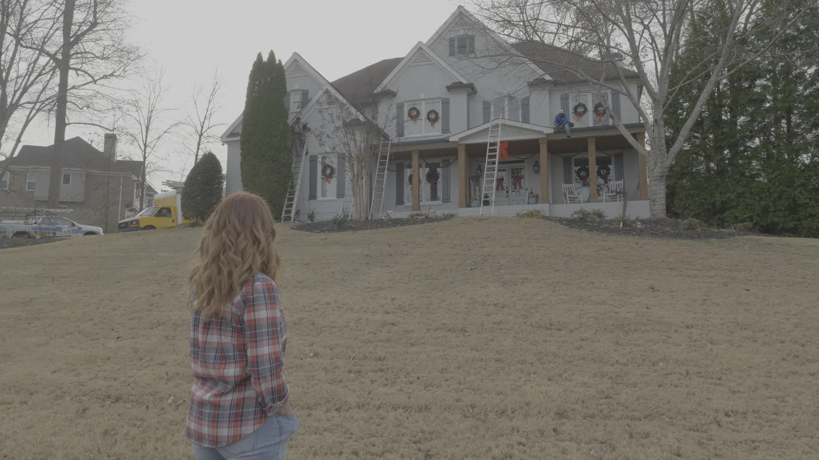 a man walking in front of a house