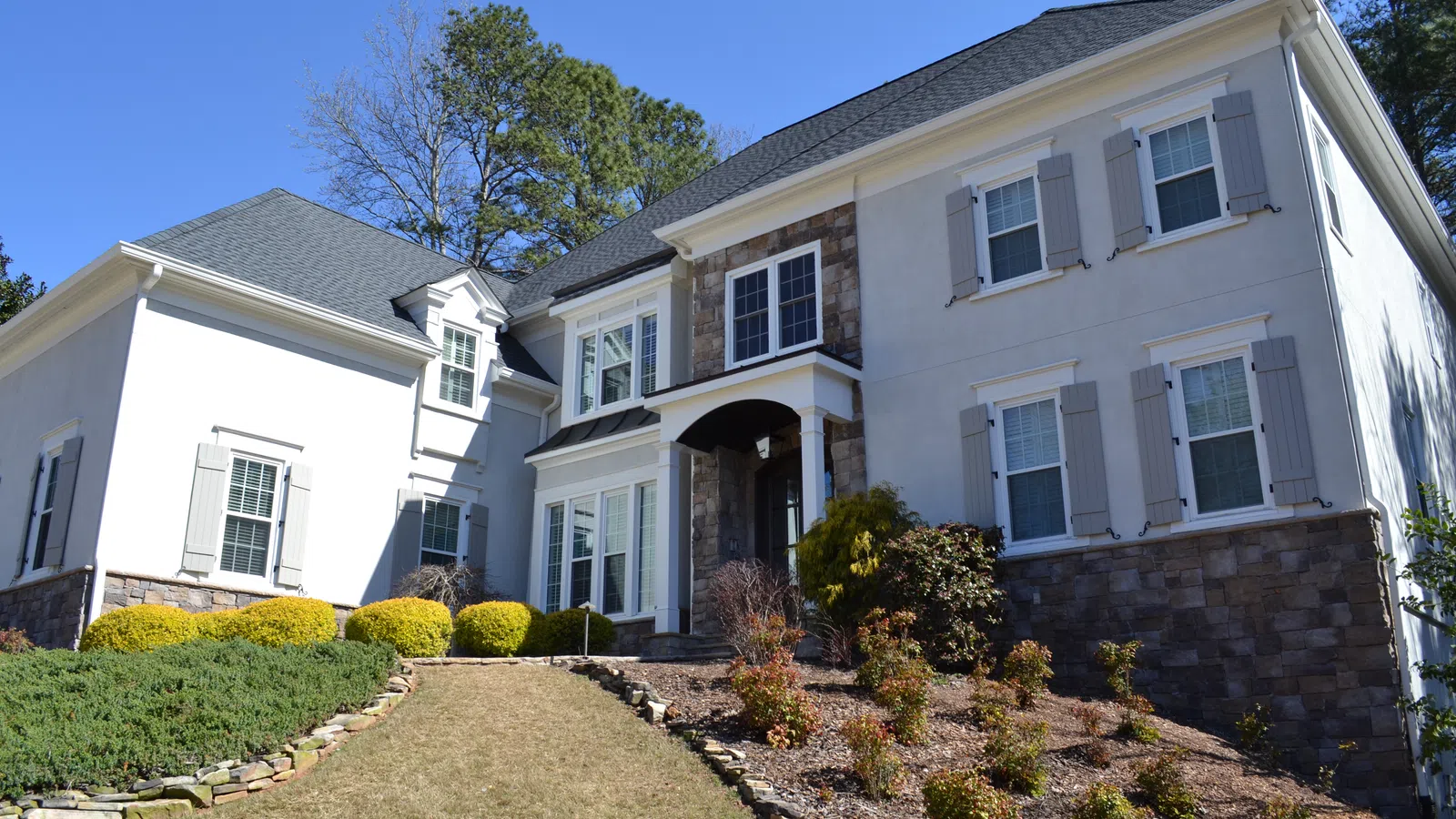 a house with a brick driveway