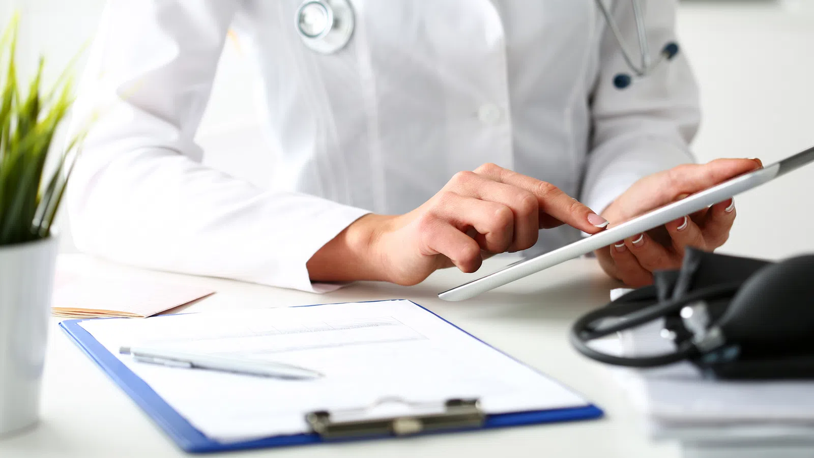 a doctor writing on a piece of paper