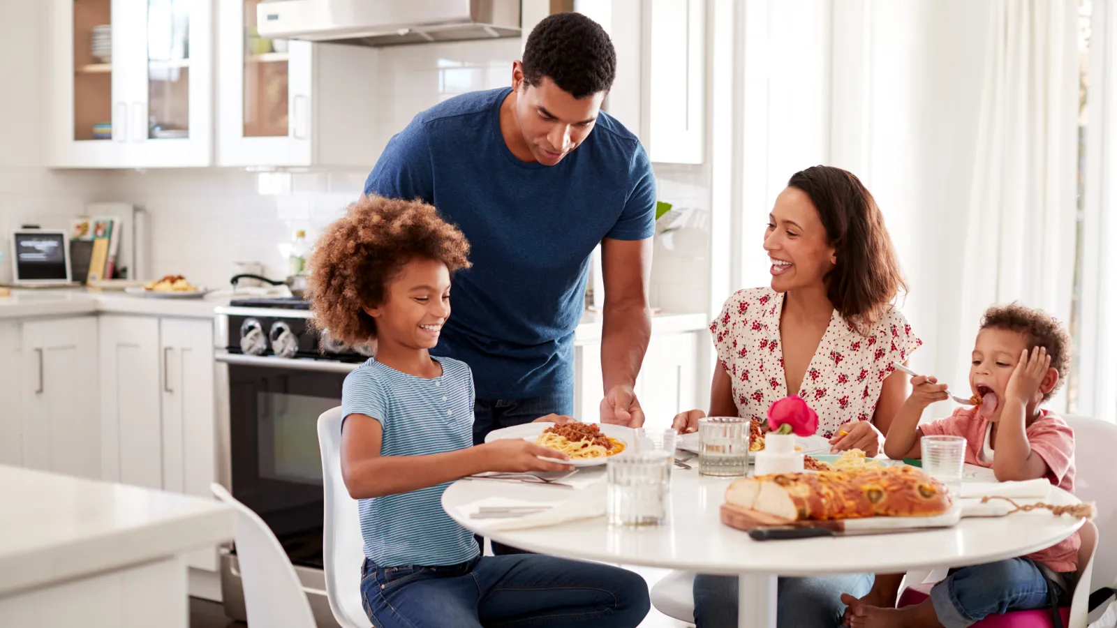 a family eating pizza