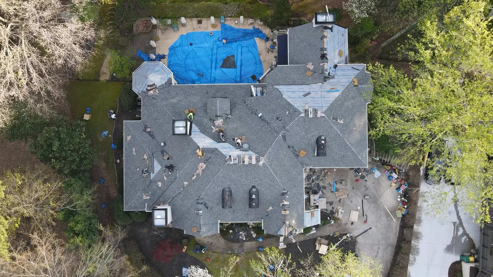 a large house with a blue tent