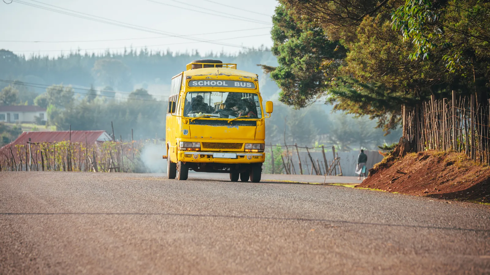 a yellow truck on a road