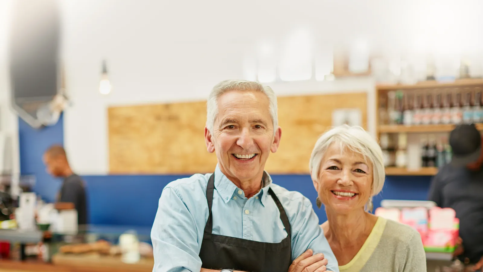 Small Business Owners in front of their sales counter