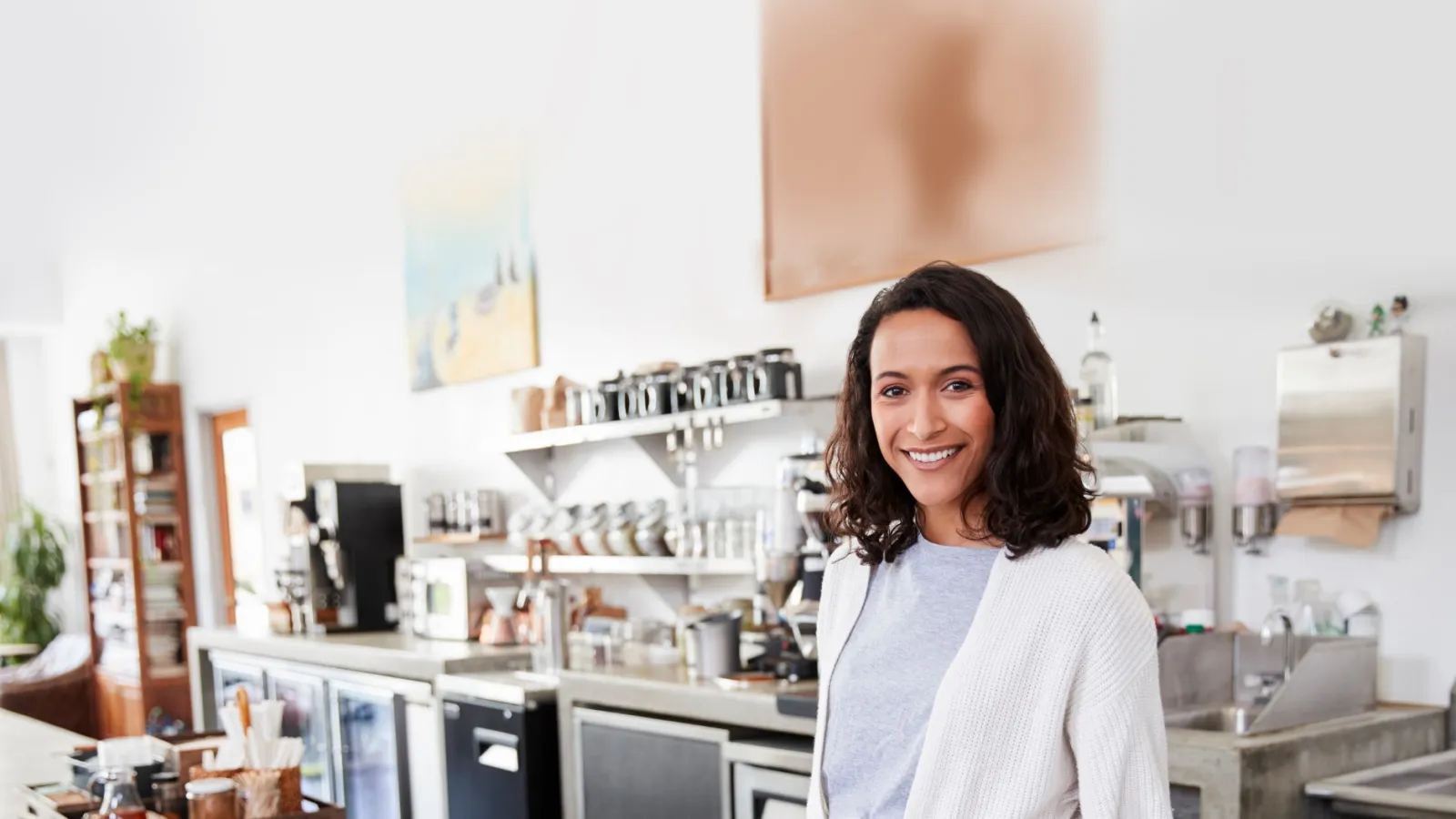 Small business woman ready to take your order in cafe