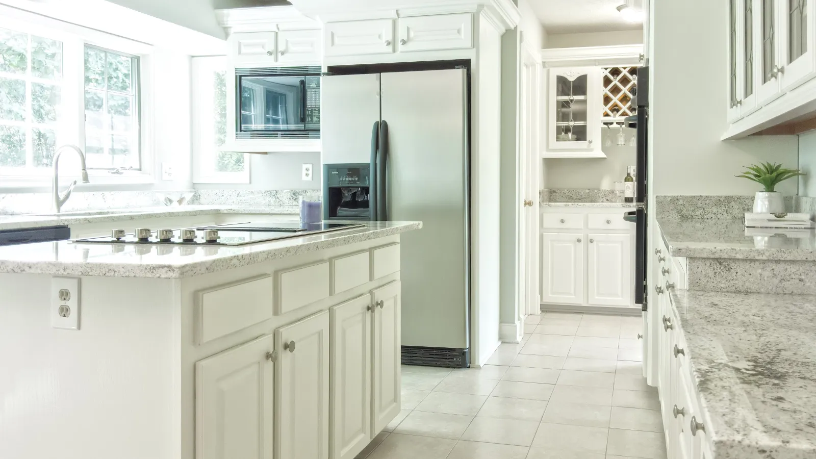 a kitchen with white cabinets