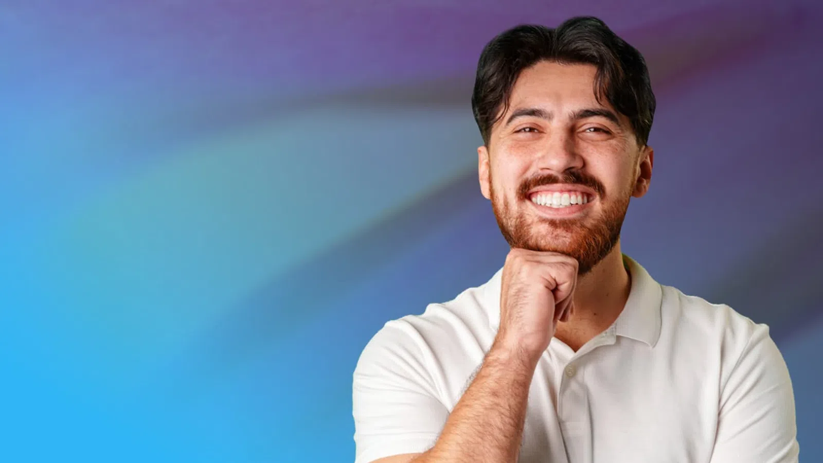 Smiling man in white polo shirt with hand on chin against blue and purple gradient background