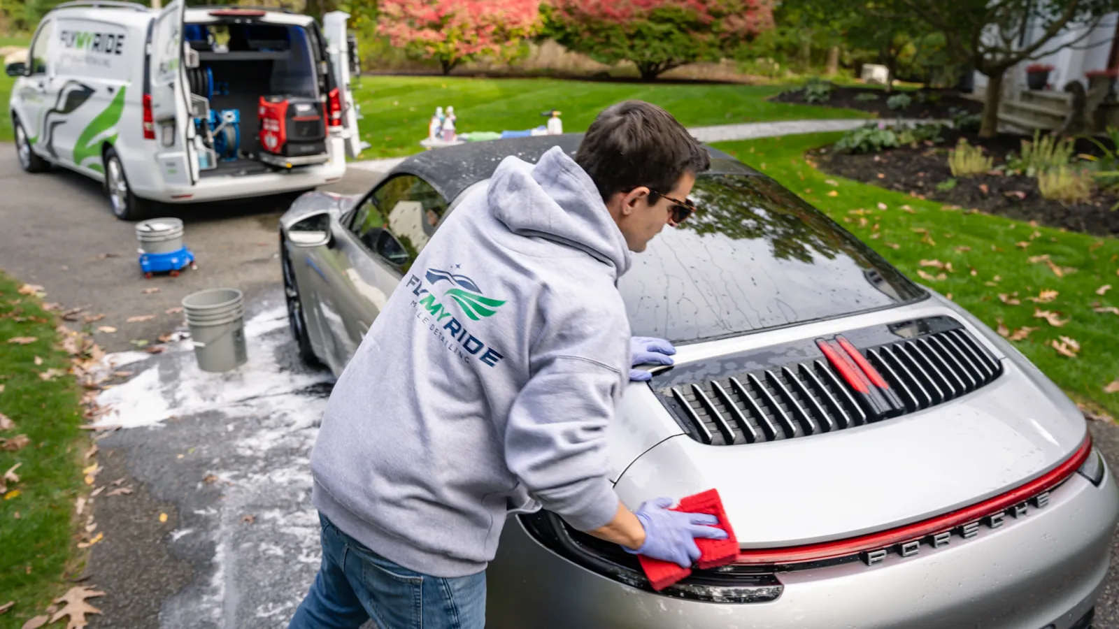 a man washing a car
