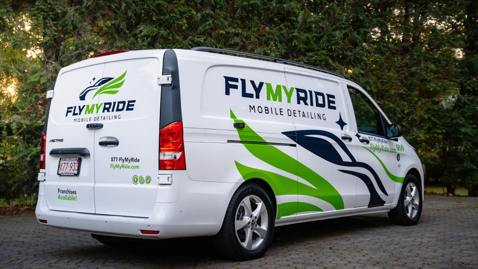 a white van with green and blue text on it