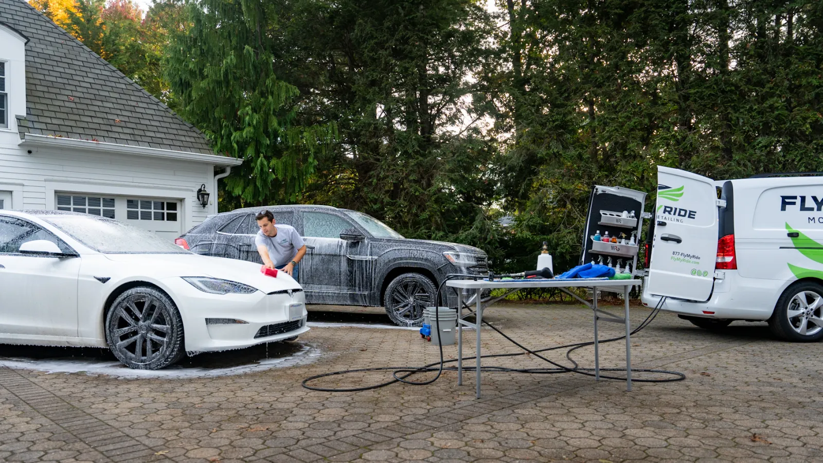 a person standing next to a car