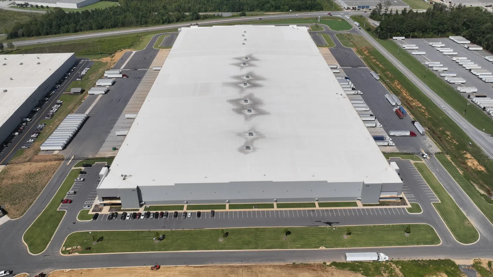 a large building with a parking lot