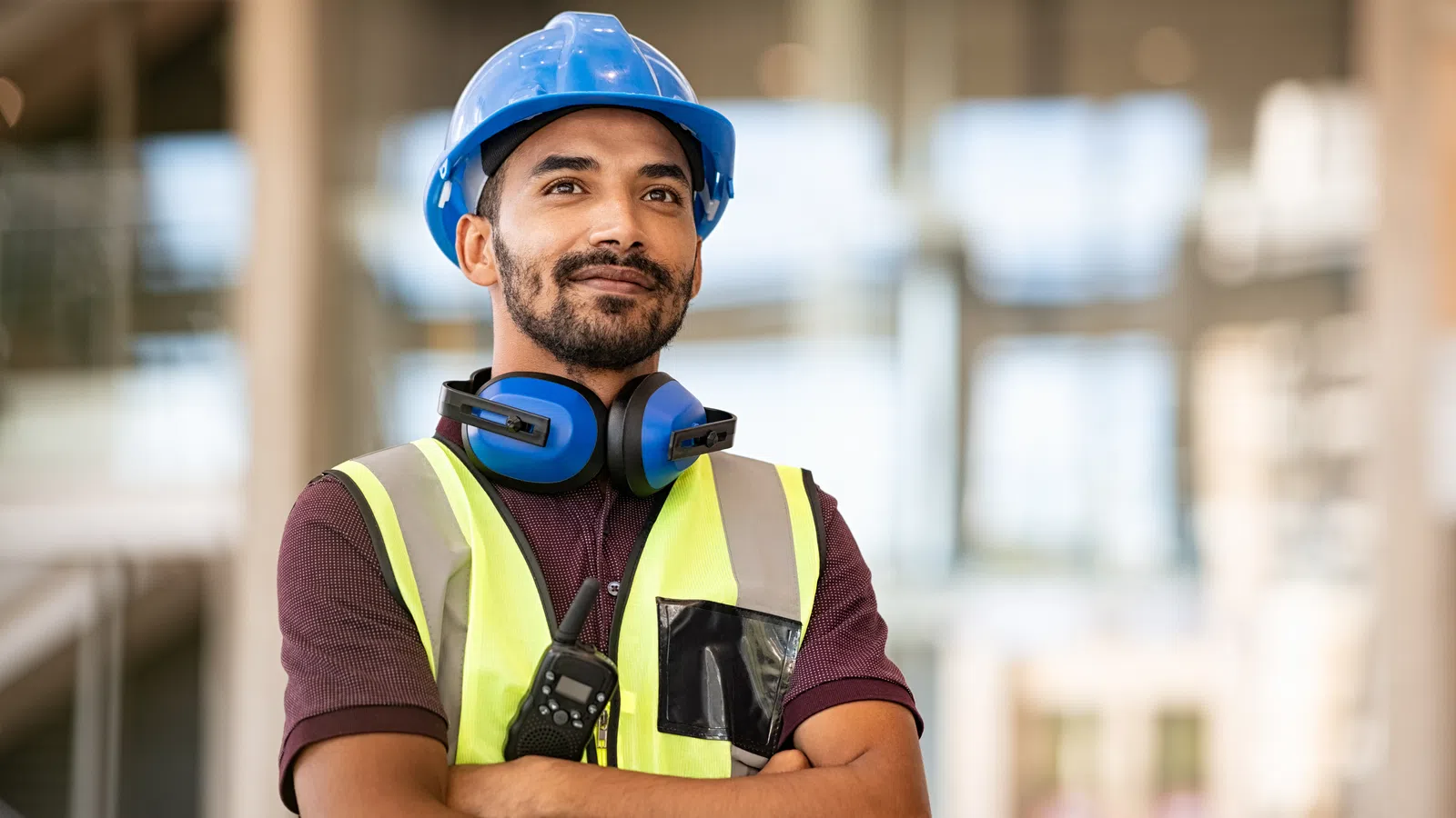 a man wearing a hard hat and safety vest
