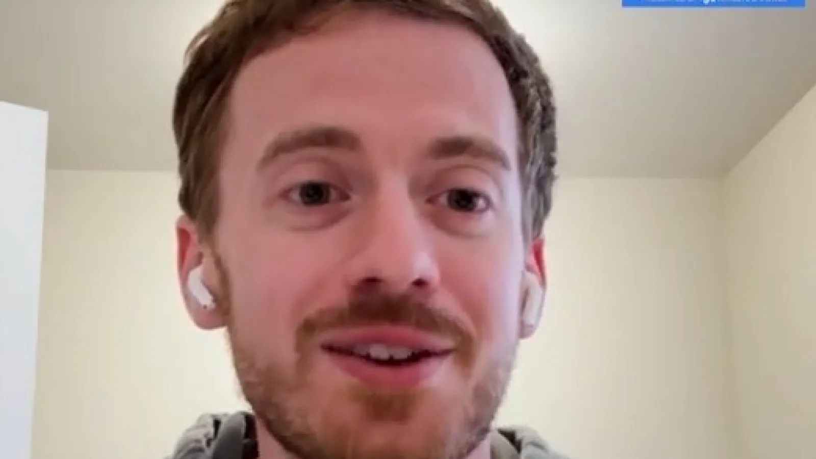 Two men in a split-screen video call talking about franchise coaching with visible microphones and branded elements.