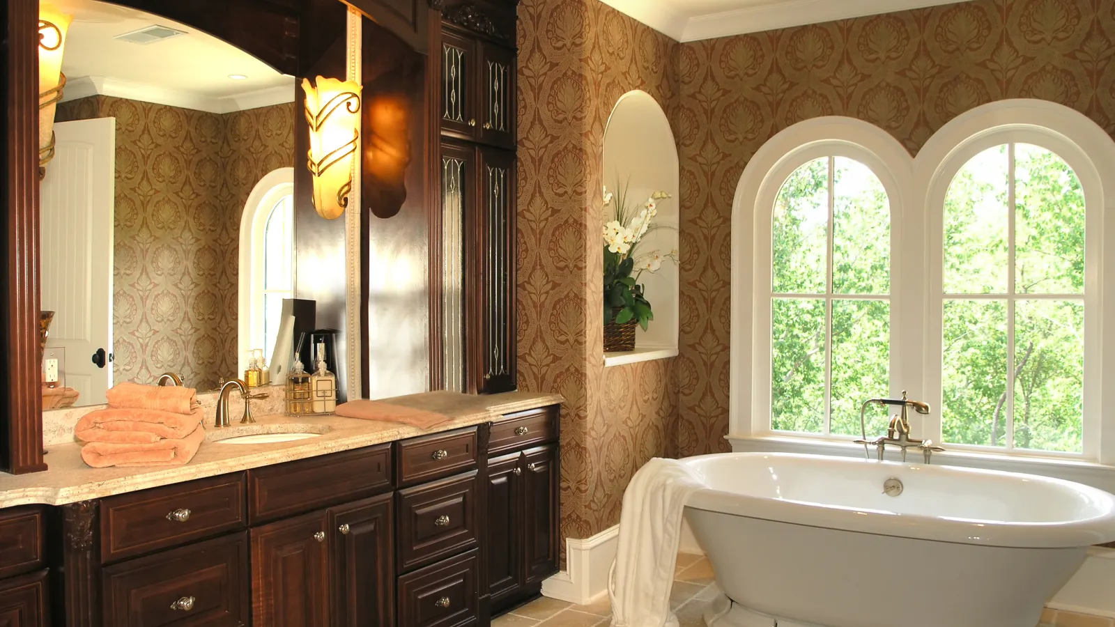 a bathroom with a tub sink and mirror